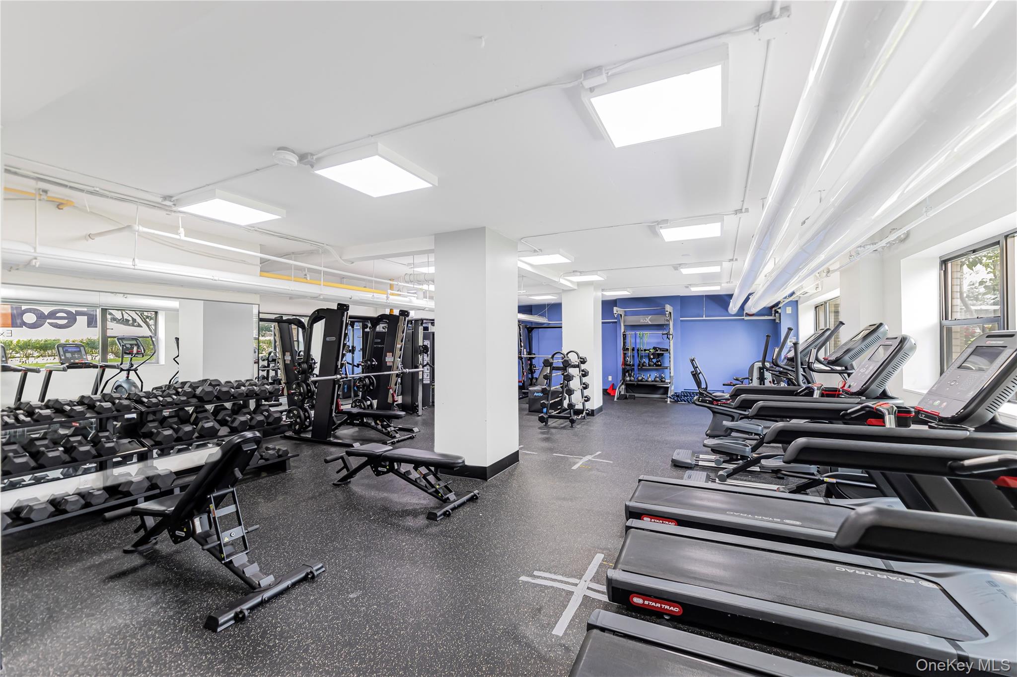2 Fordham Hill Ovl, Unit 2F Bronx, NY 10468 - Photo 22 of 27 a room with gym equipment and a large window