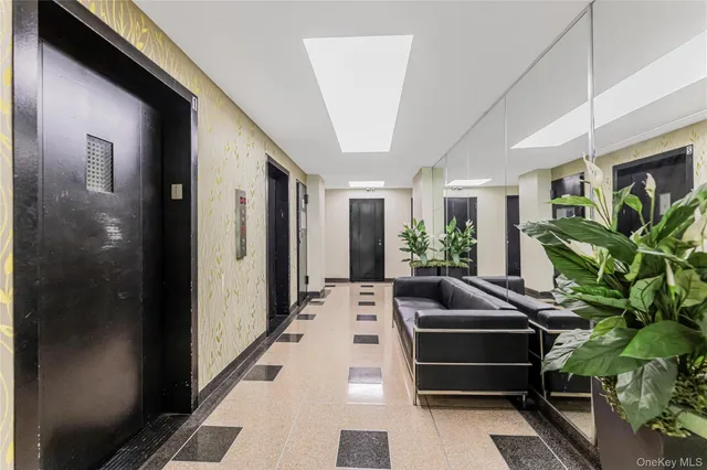 a view of a hallway with potted plants