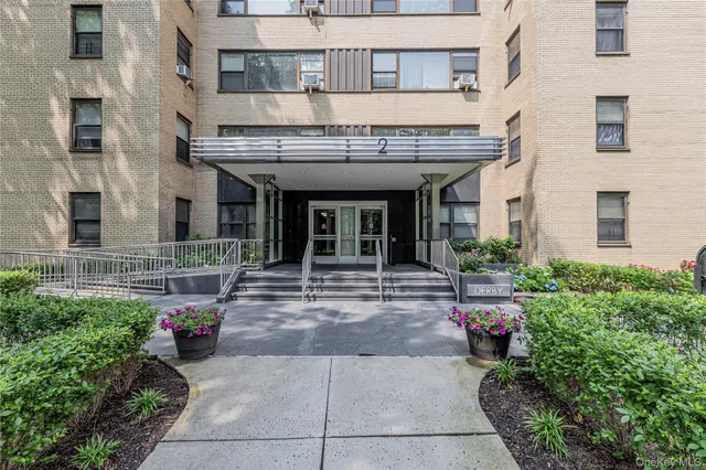 a view of a building with potted plants