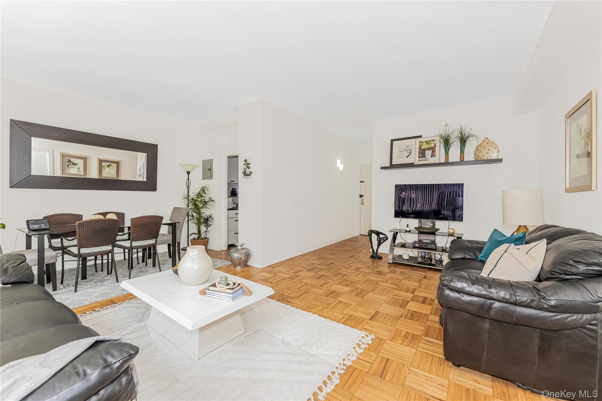 2 Fordham Hill Ovl, Unit 2F Bronx, NY 10468 - Photo 5 of 27 a living room with furniture and a flat screen tv