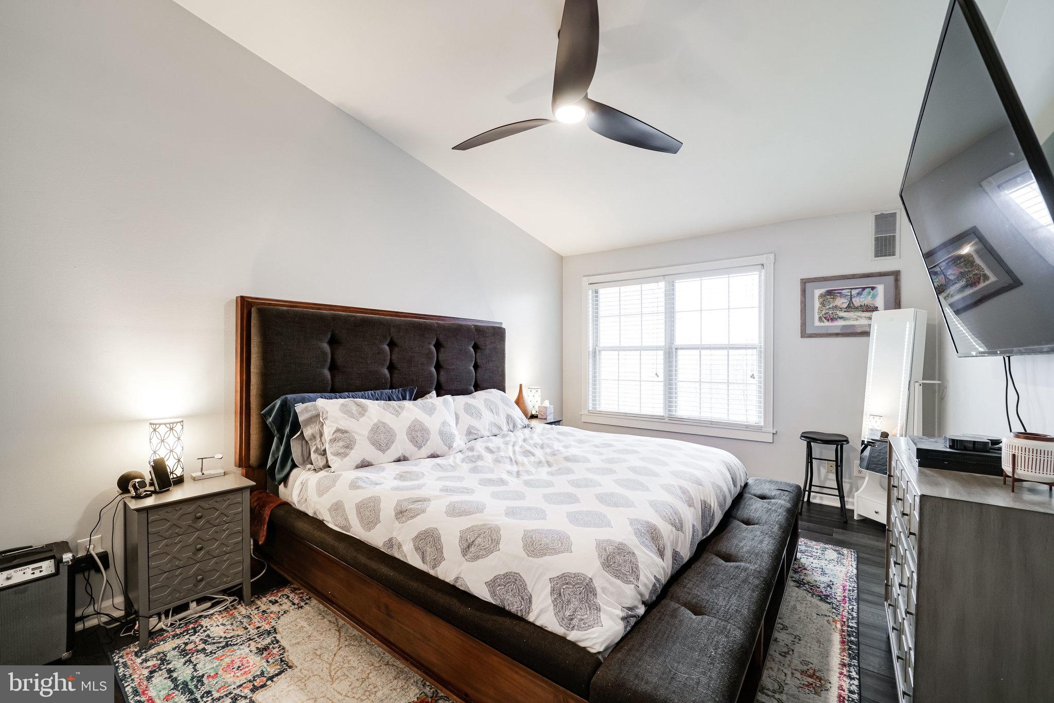 7510 Ashby Lane, Unit J Alexandria, VA 22315 - Photo 20 of 53 a bedroom with a large bed and a window