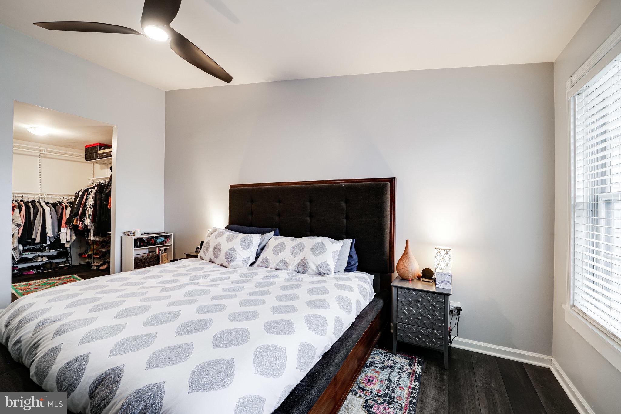 7510 Ashby Lane, Unit J Alexandria, VA 22315 - Photo 22 of 53 a bedroom with a bed and wooden floor