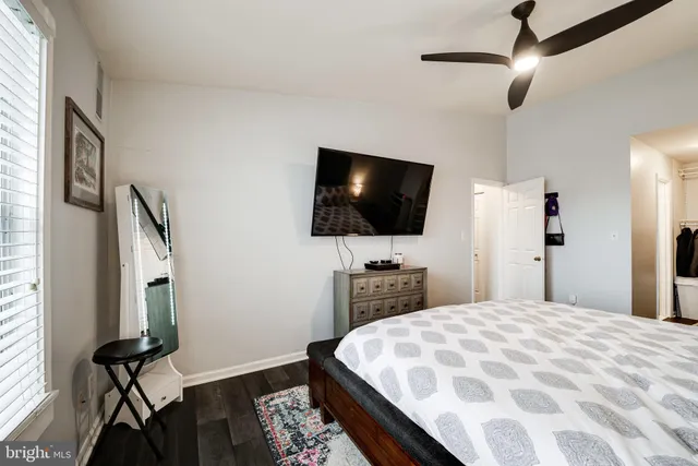 a bathroom with a sink toilet vanity and shower