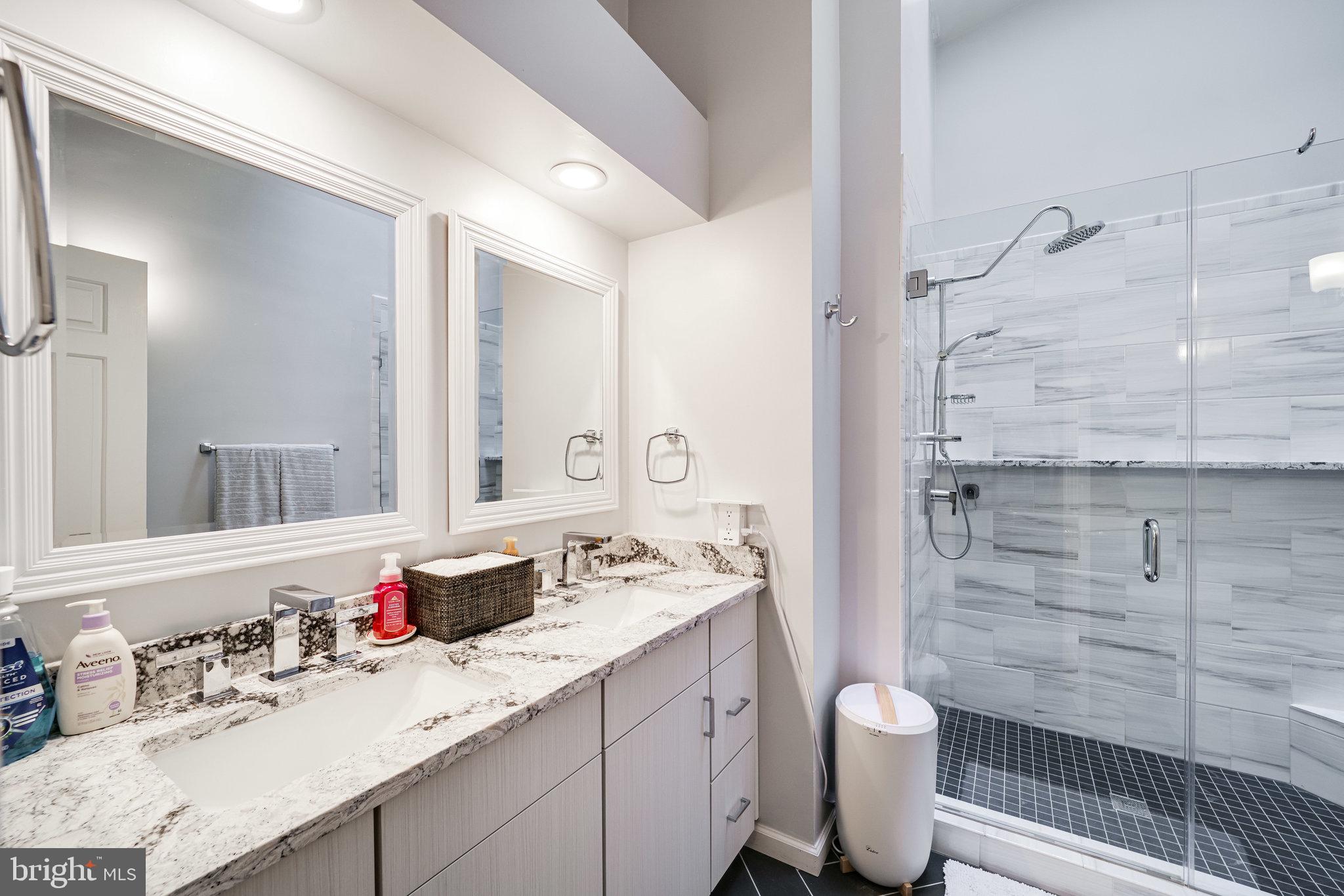 7510 Ashby Lane, Unit J Alexandria, VA 22315 - Photo 24 of 53 a bathroom with a sink toilet vanity and shower