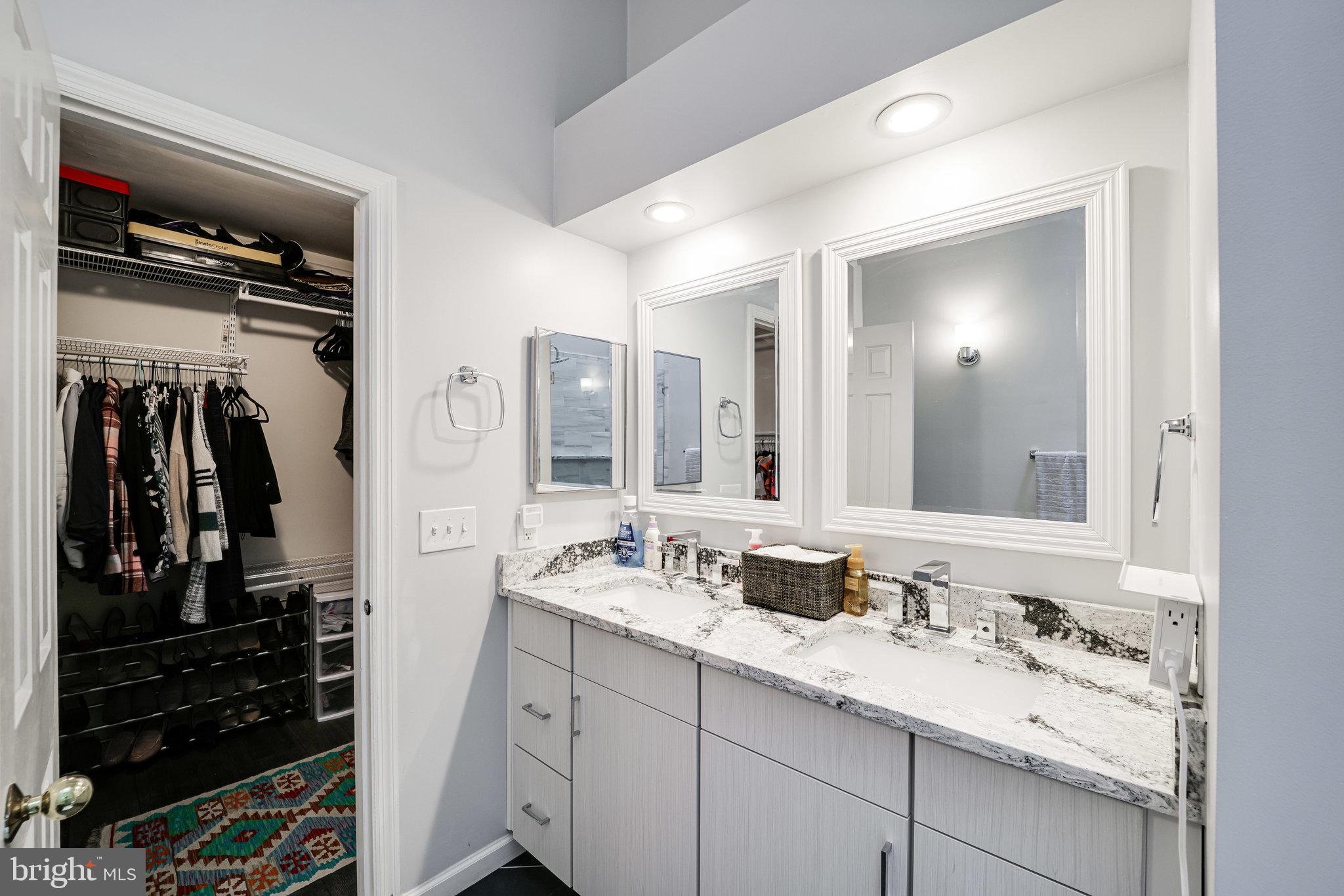 7510 Ashby Lane, Unit J Alexandria, VA 22315 - Photo 25 of 53 a bathroom with a sink and a mirror