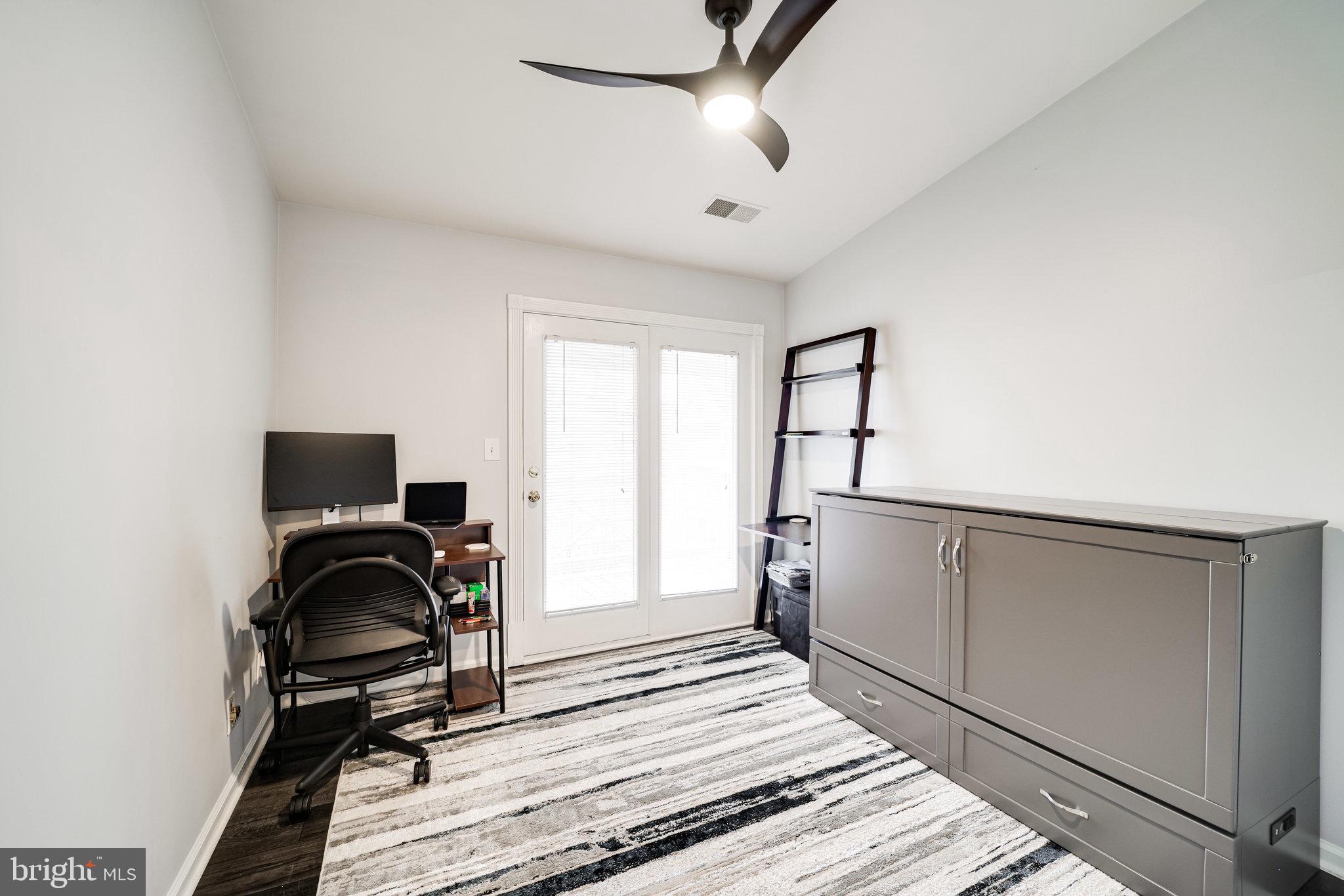 7510 Ashby Lane, Unit J Alexandria, VA 22315 - Photo 27 of 53 a view of a workspace with furniture and a window