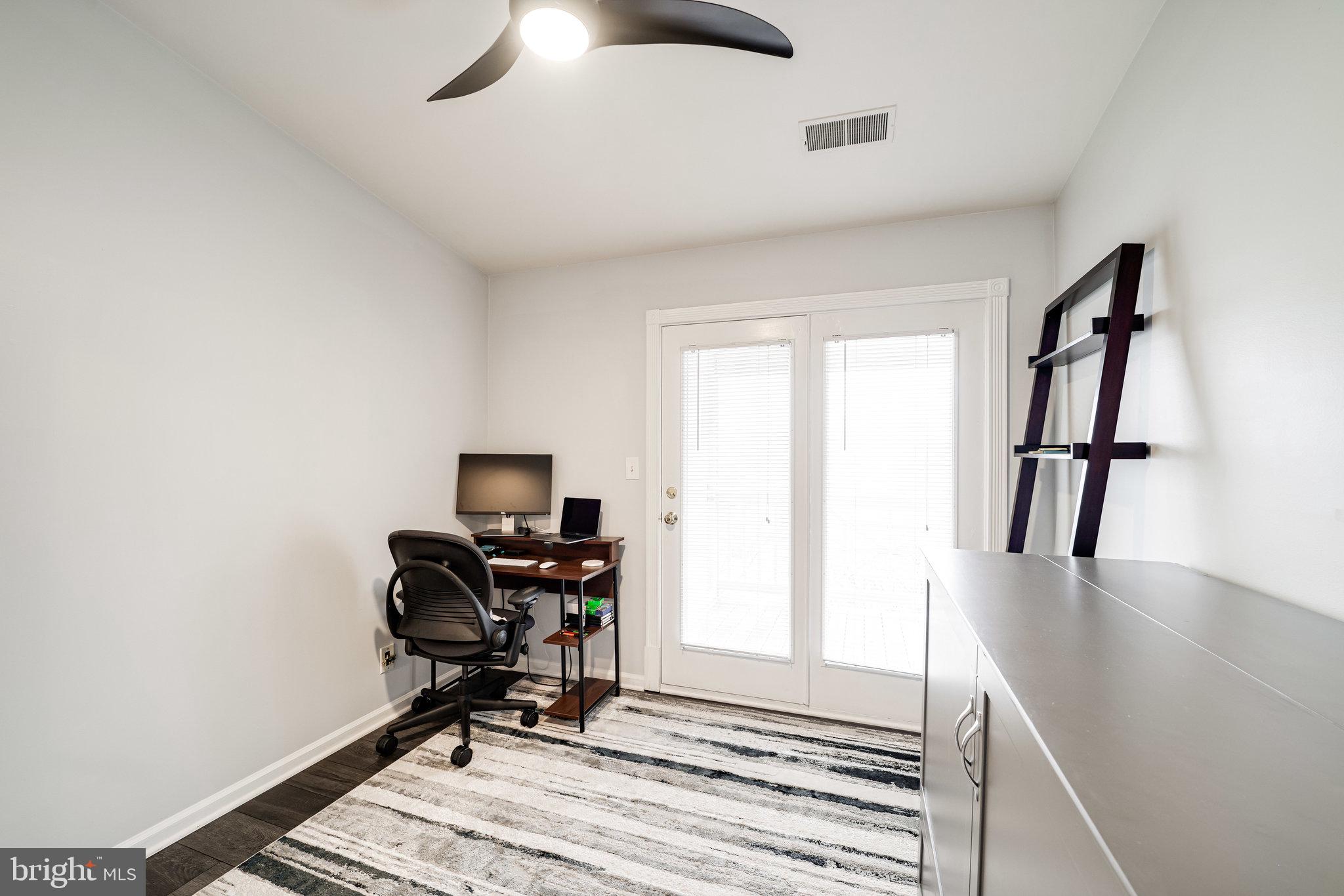 7510 Ashby Lane, Unit J Alexandria, VA 22315 - Photo 28 of 53 a view of a workspace with furniture and a window