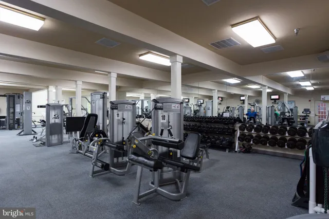 a view of a patio with a table and chairs