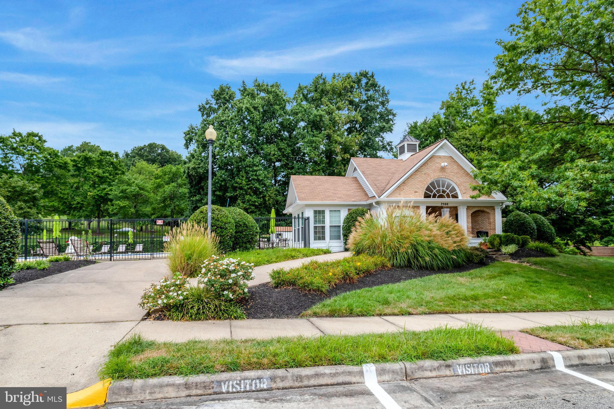 7510 Ashby Lane, Unit J Alexandria, VA 22315 - Photo 49 of 53 a front view of a house with a yard