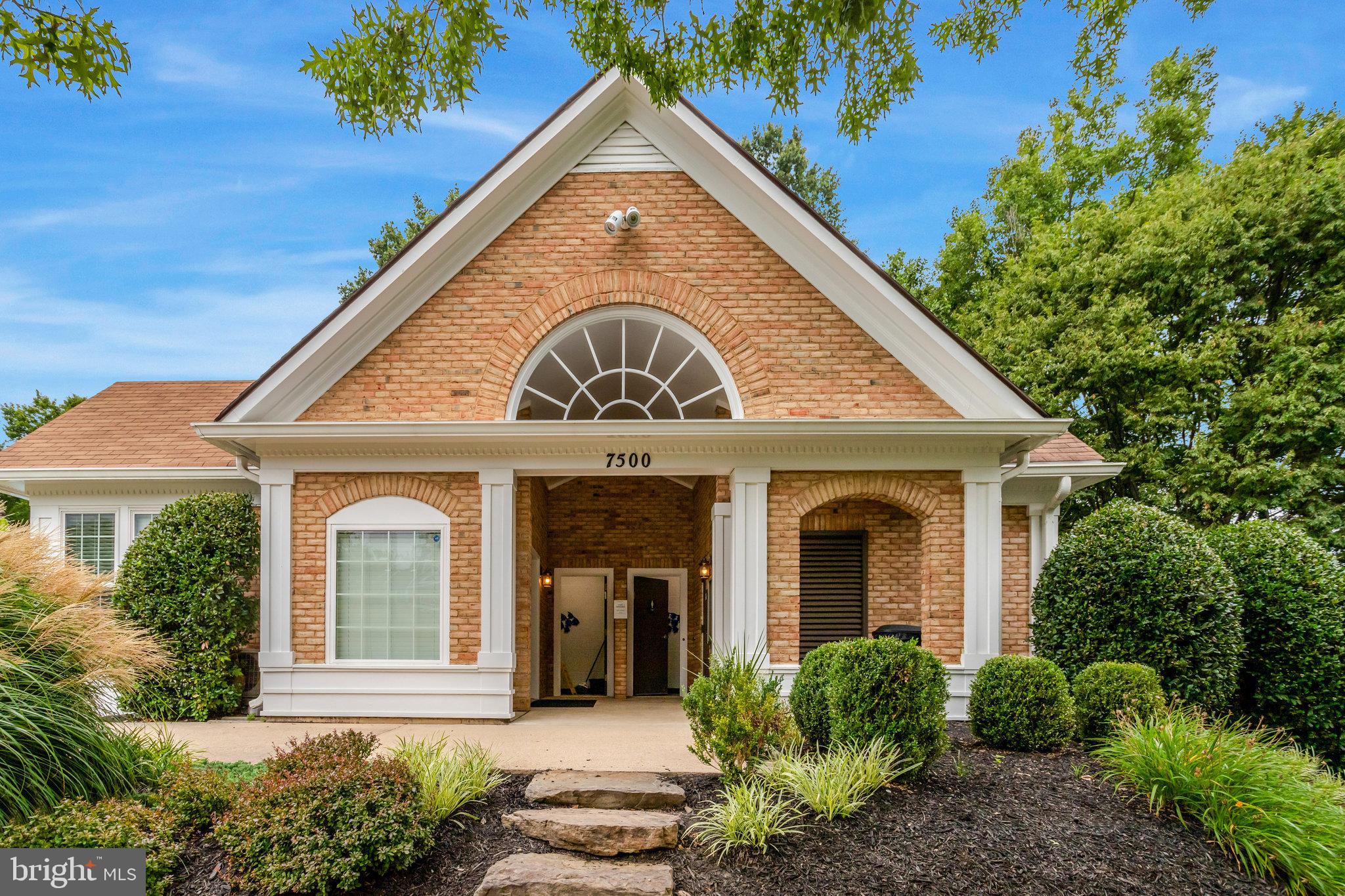 7510 Ashby Lane, Unit J Alexandria, VA 22315 - Photo 50 of 53 a front view of a house with a garden
