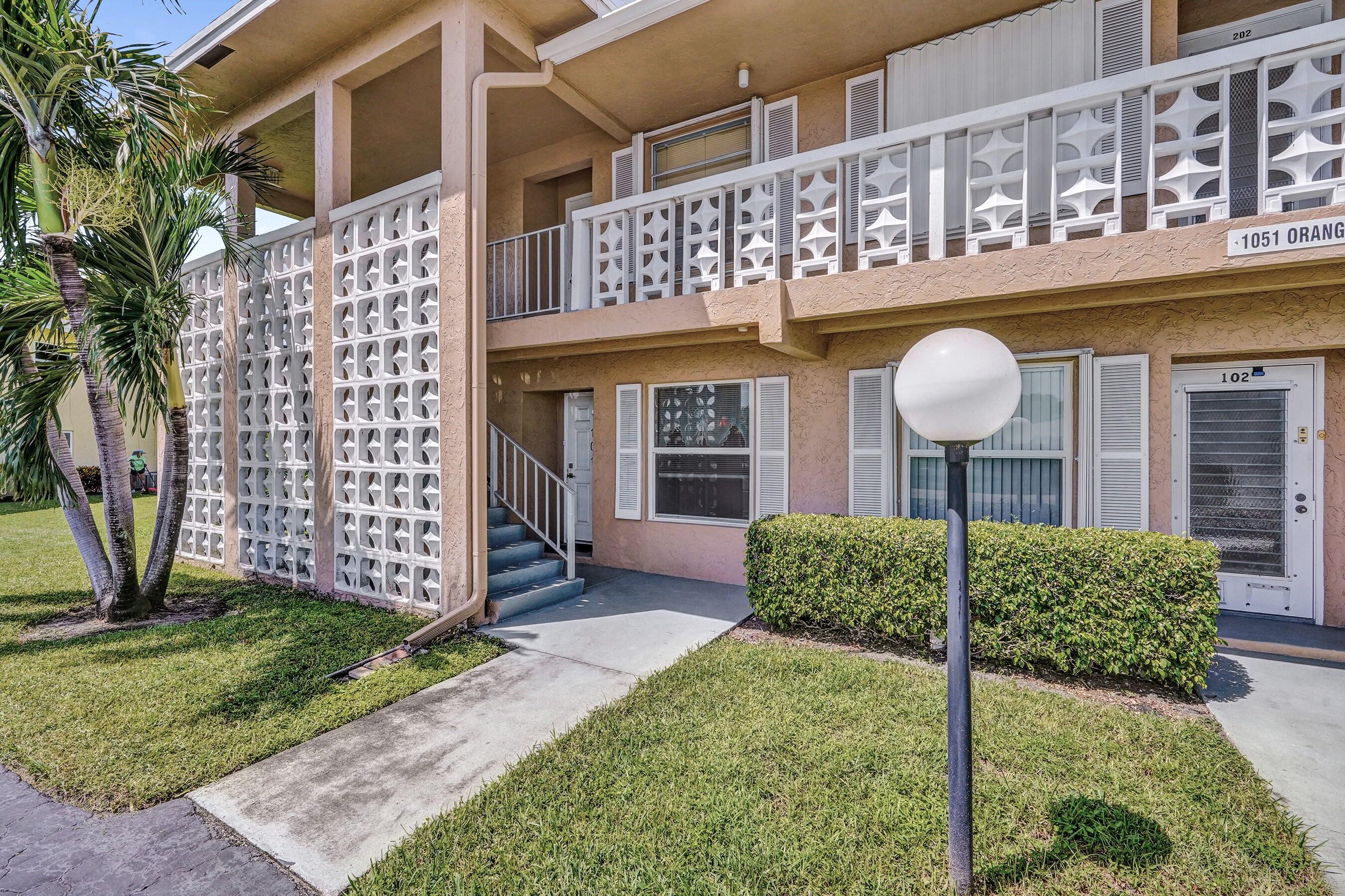 1051 Orange Terrace, Unit 101 Delray Beach, FL 33445 - Photo 1 of 54 a front view of a house