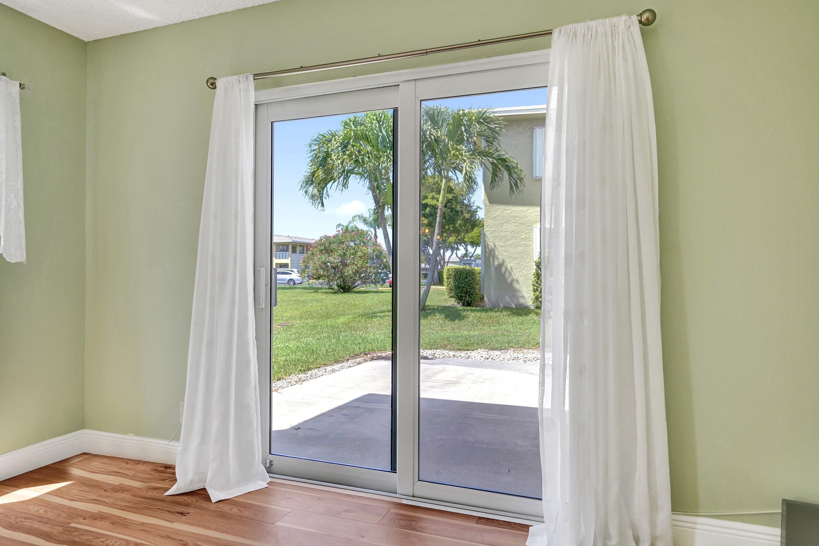 1051 Orange Terrace, Unit 101 Delray Beach, FL 33445 - Photo 13 of 54 a view of front door and deck