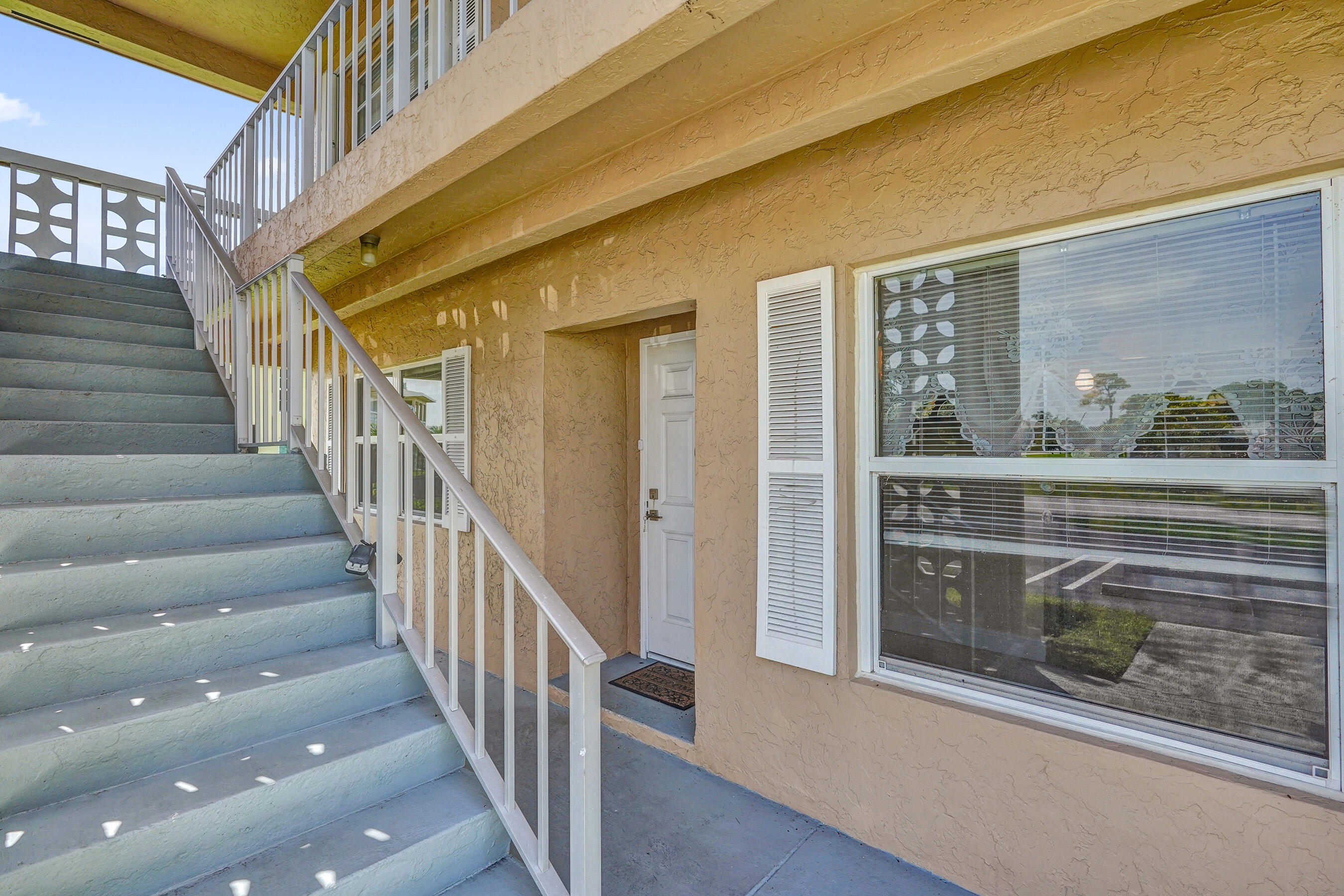 1051 Orange Terrace, Unit 101 Delray Beach, FL 33445 - Photo 2 of 54 a view of an entryway with livingroom