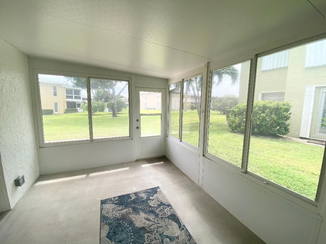 1051 Orange Terrace, Unit 101 Delray Beach, FL 33445 - Photo 22 of 54 a view of an empty room and window