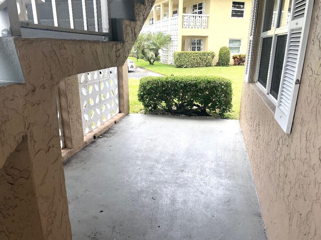 1051 Orange Terrace, Unit 101 Delray Beach, FL 33445 - Photo 26 of 54 Under roof patio