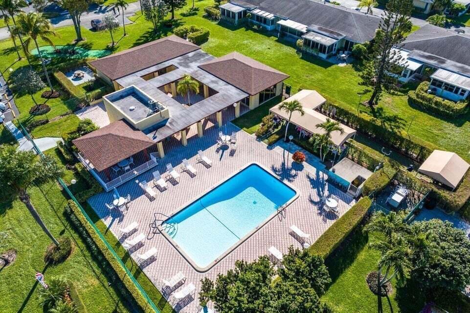 1051 Orange Terrace, Unit 101 Delray Beach, FL 33445 - Photo 46 of 54 an aerial view of a house with a garden
