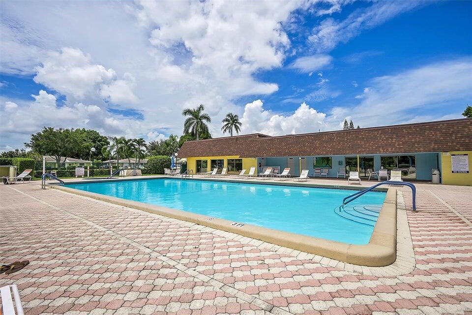 1051 Orange Terrace, Unit 101 Delray Beach, FL 33445 - Photo 50 of 54 a view of a house with swimming pool