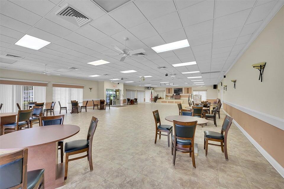 1051 Orange Terrace, Unit 101 Delray Beach, FL 33445 - Photo 54 of 54 a view of a dining area with furniture