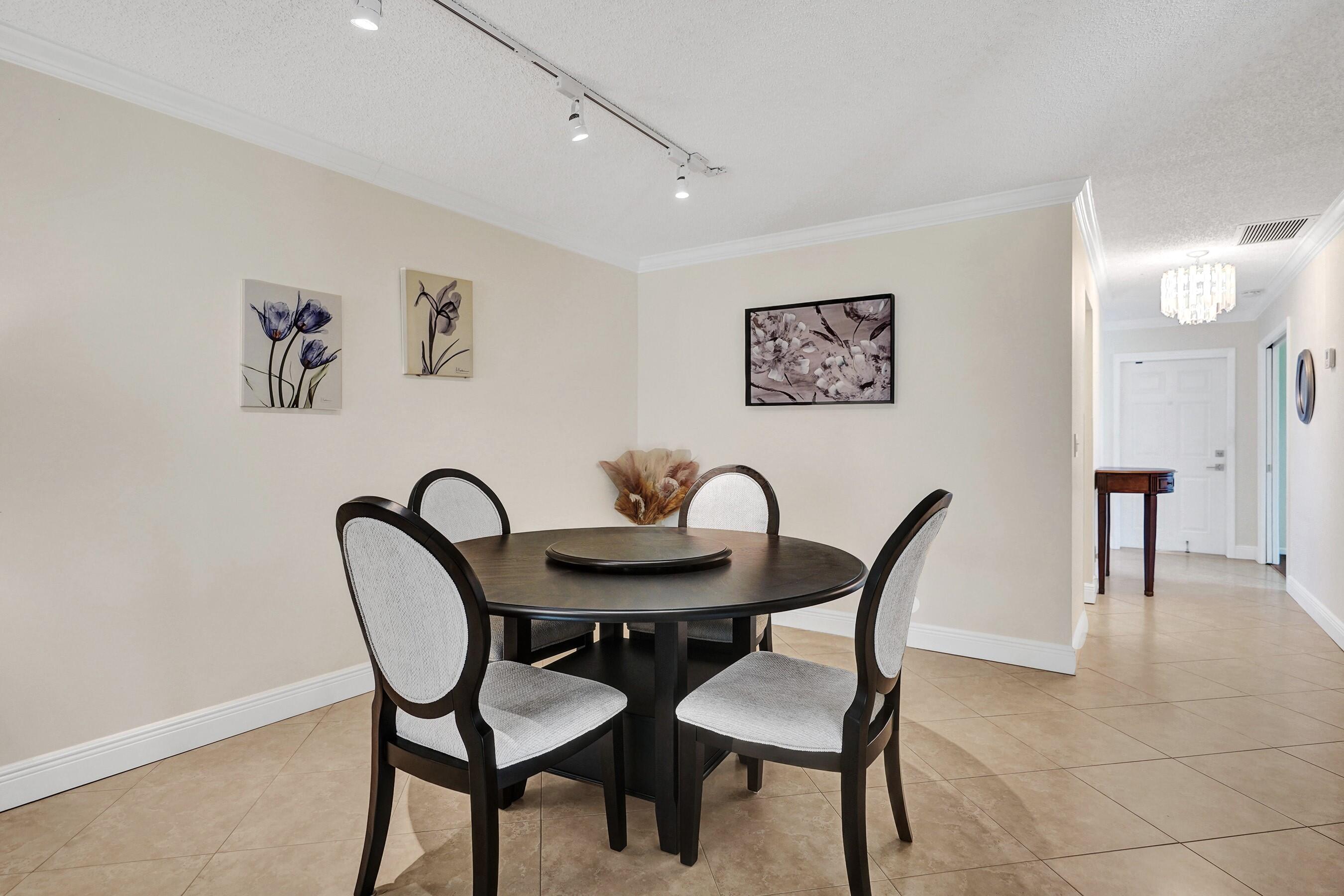 1051 Orange Terrace, Unit 101 Delray Beach, FL 33445 - Photo 7 of 54 a view of a dining room with furniture