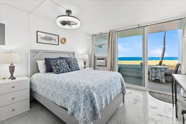 a bedroom with a bed and a lamp