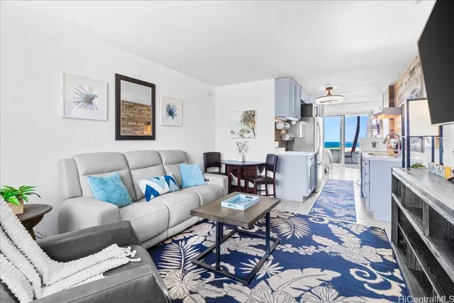 a living room with furniture and a rug