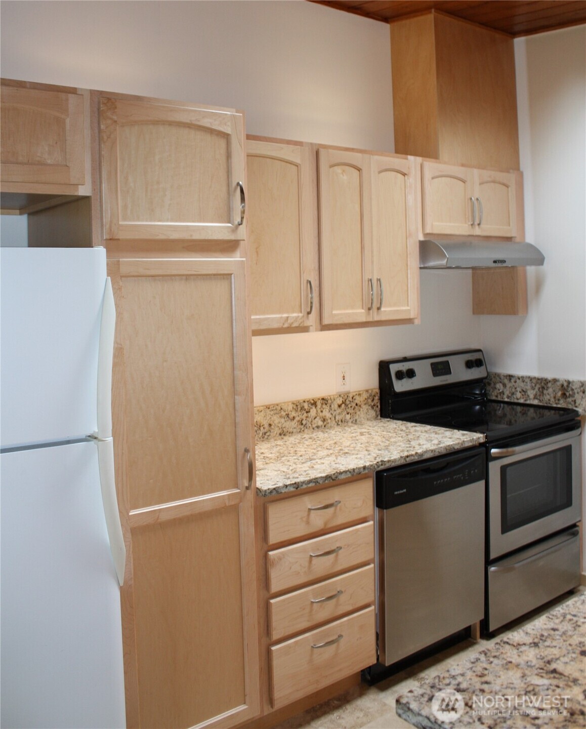 8417 Gold Way Everett, WA 98208 - Photo 13 of 18 a kitchen with granite countertop cabinets appliances and a counter top space