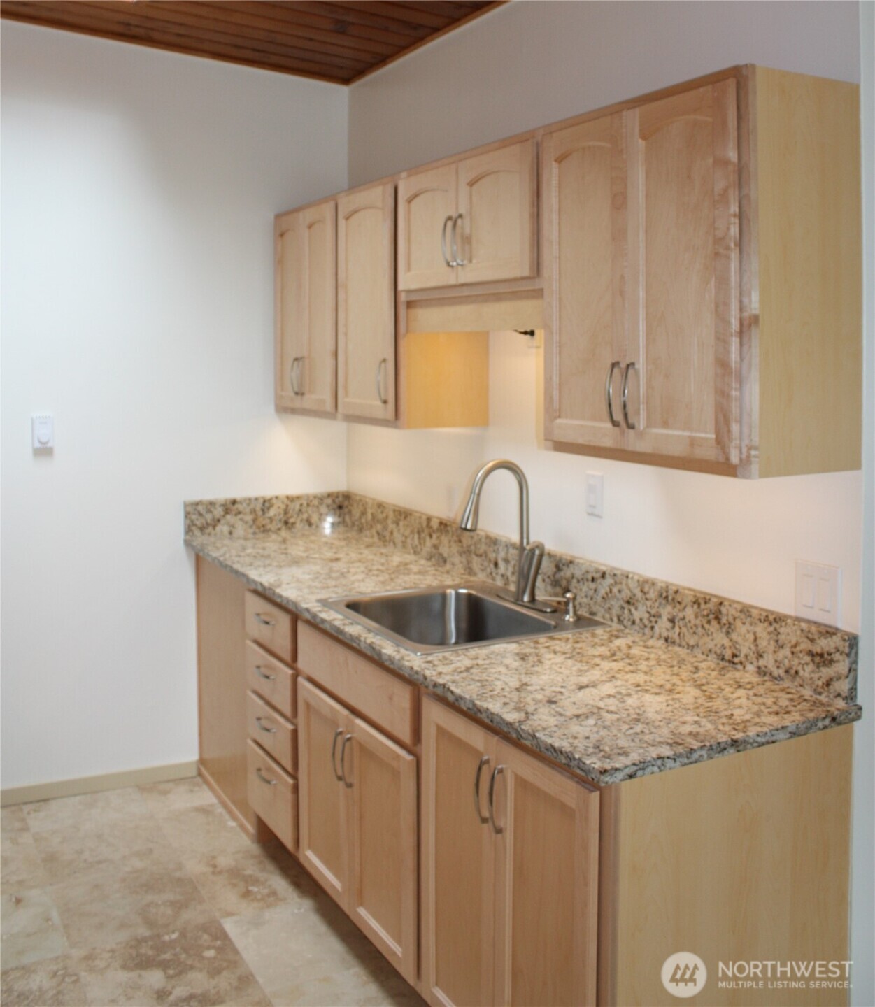 8417 Gold Way Everett, WA 98208 - Photo 14 of 18 a kitchen with a sink and cabinets