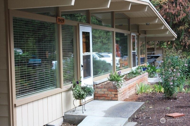8417 Gold Way Everett, WA 98208 - Photo 3 of 18 a house with a potted plant in front of it