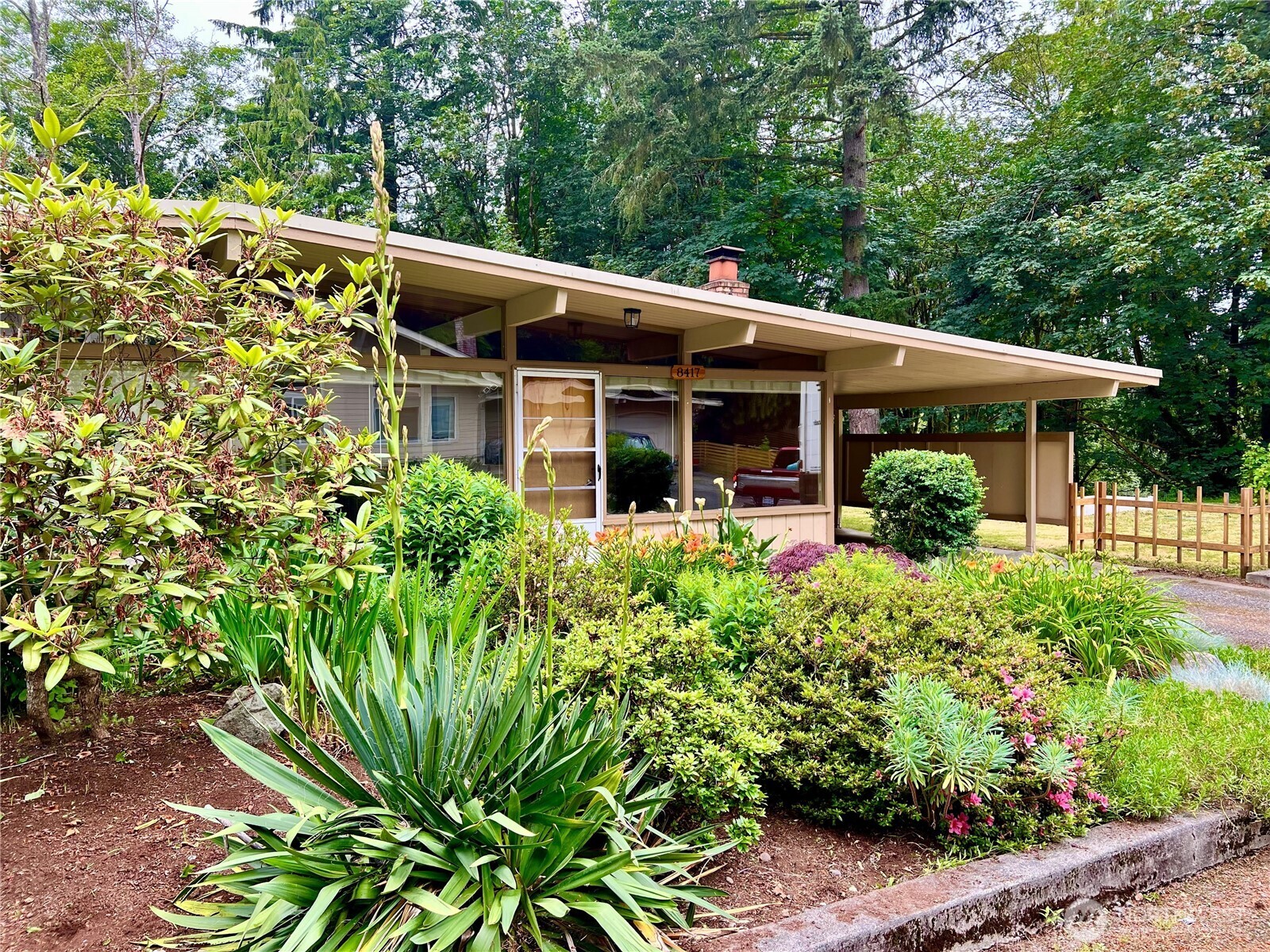 8417 Gold Way Everett, WA 98208 - Photo 10 of 18 a front view of a house with garden
