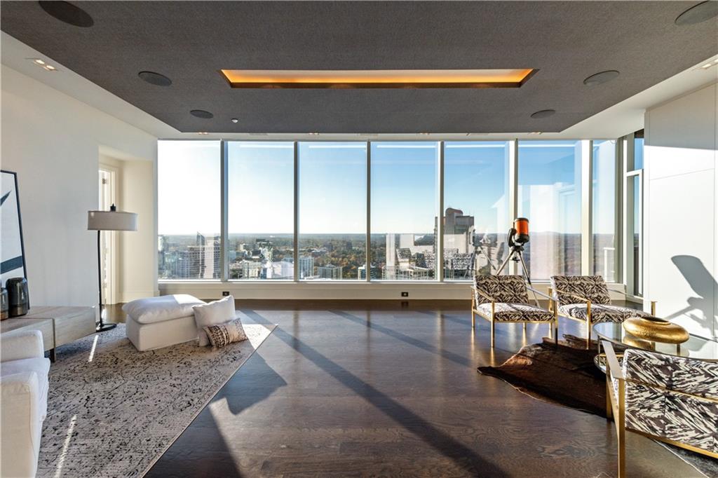 3630 Peachtree Road Northeast, Unit 3401 Atlanta, GA 30326 - Photo 15 of 72 a living room with furniture and a large window
