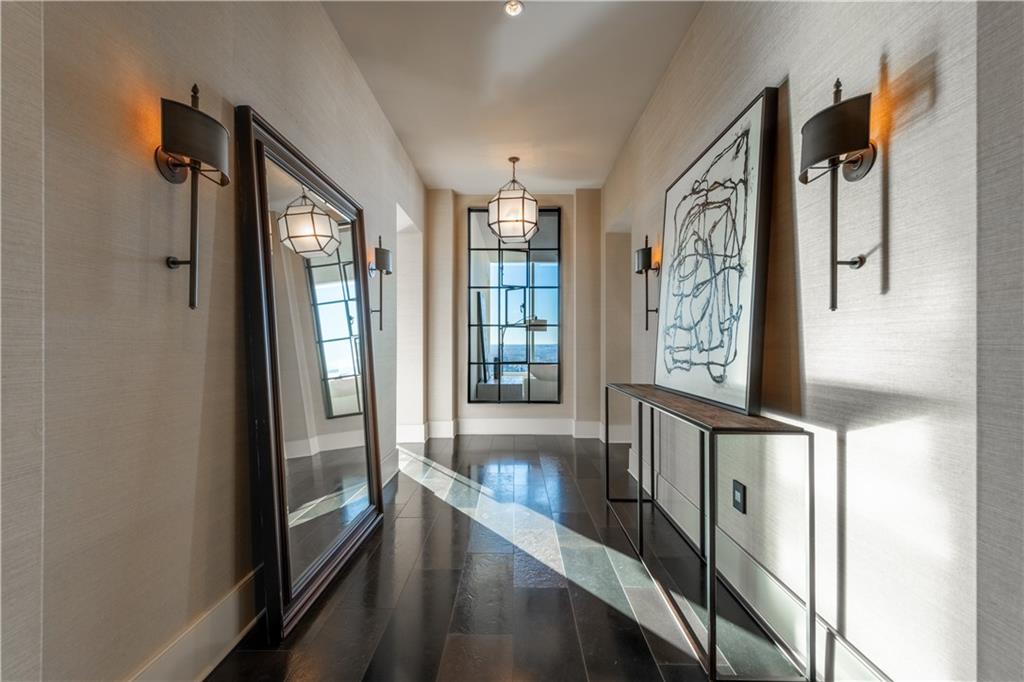 3630 Peachtree Road Northeast, Unit 3401 Atlanta, GA 30326 - Photo 2 of 72 a view of a hallway with windows and chandelier