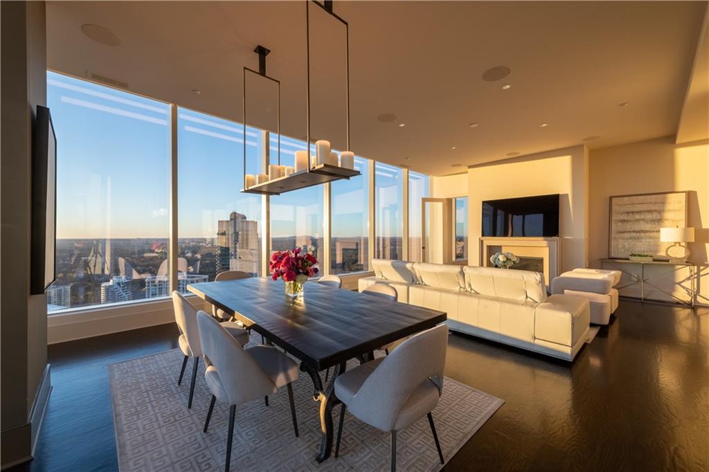 3630 Peachtree Road Northeast, Unit 3401 Atlanta, GA 30326 - Photo 43 of 72 a view of a dining room with furniture and wooden floor