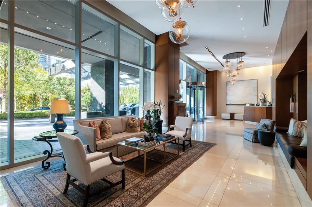 3630 Peachtree Road Northeast, Unit 3401 Atlanta, GA 30326 - Photo 61 of 72 a living room with furniture and a large window