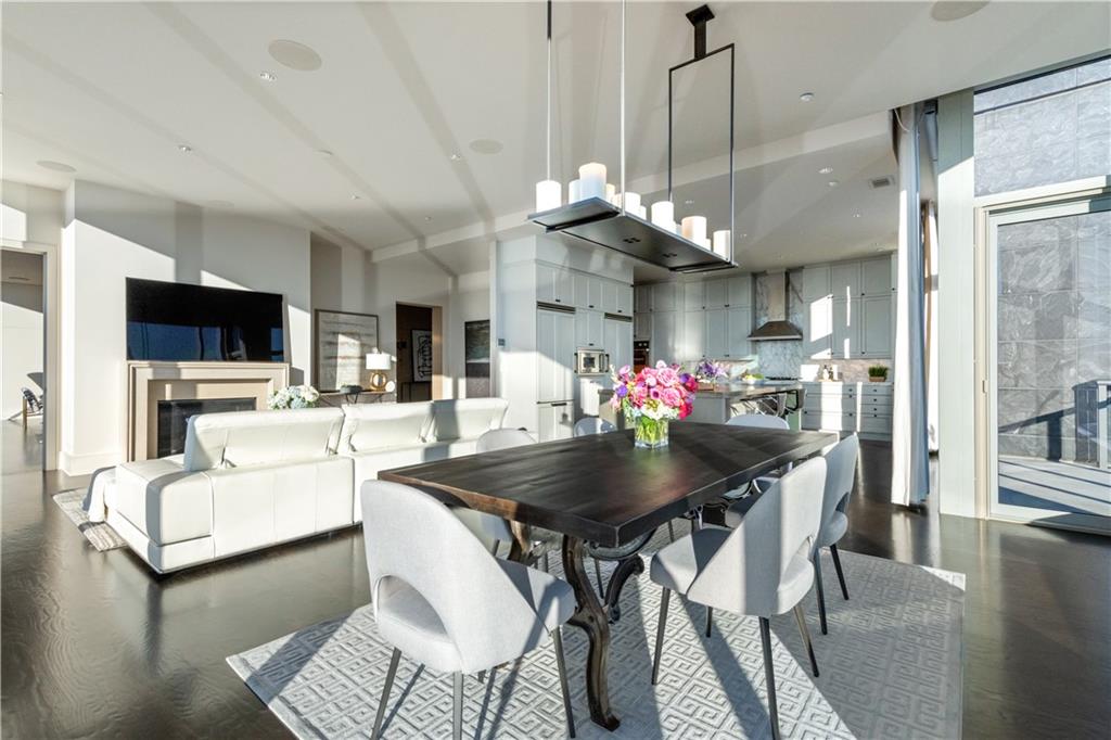 3630 Peachtree Road Northeast, Unit 3401 Atlanta, GA 30326 - Photo 7 of 72 a view of a dining room with furniture and a chandelier