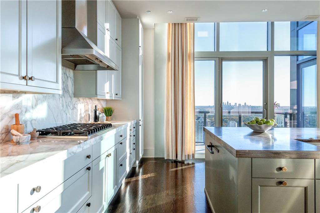 3630 Peachtree Road Northeast, Unit 3401 Atlanta, GA 30326 - Photo 10 of 72 a kitchen with stainless steel appliances granite countertop a sink and a cabinets