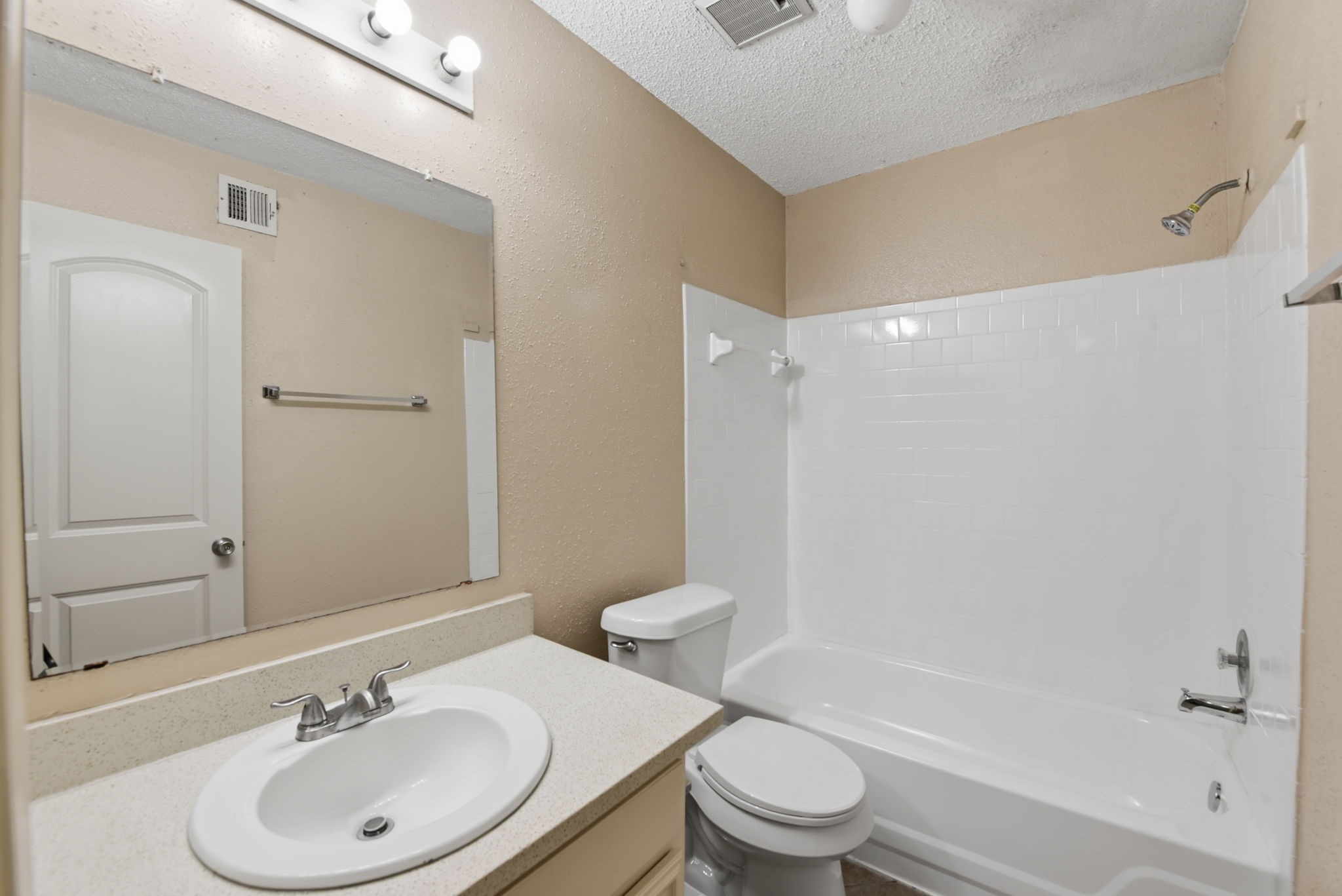 1310 Brenda Lane, Unit A Humble, TX 77338 - Photo 15 of 16 a bathroom with a sink toilet and shower