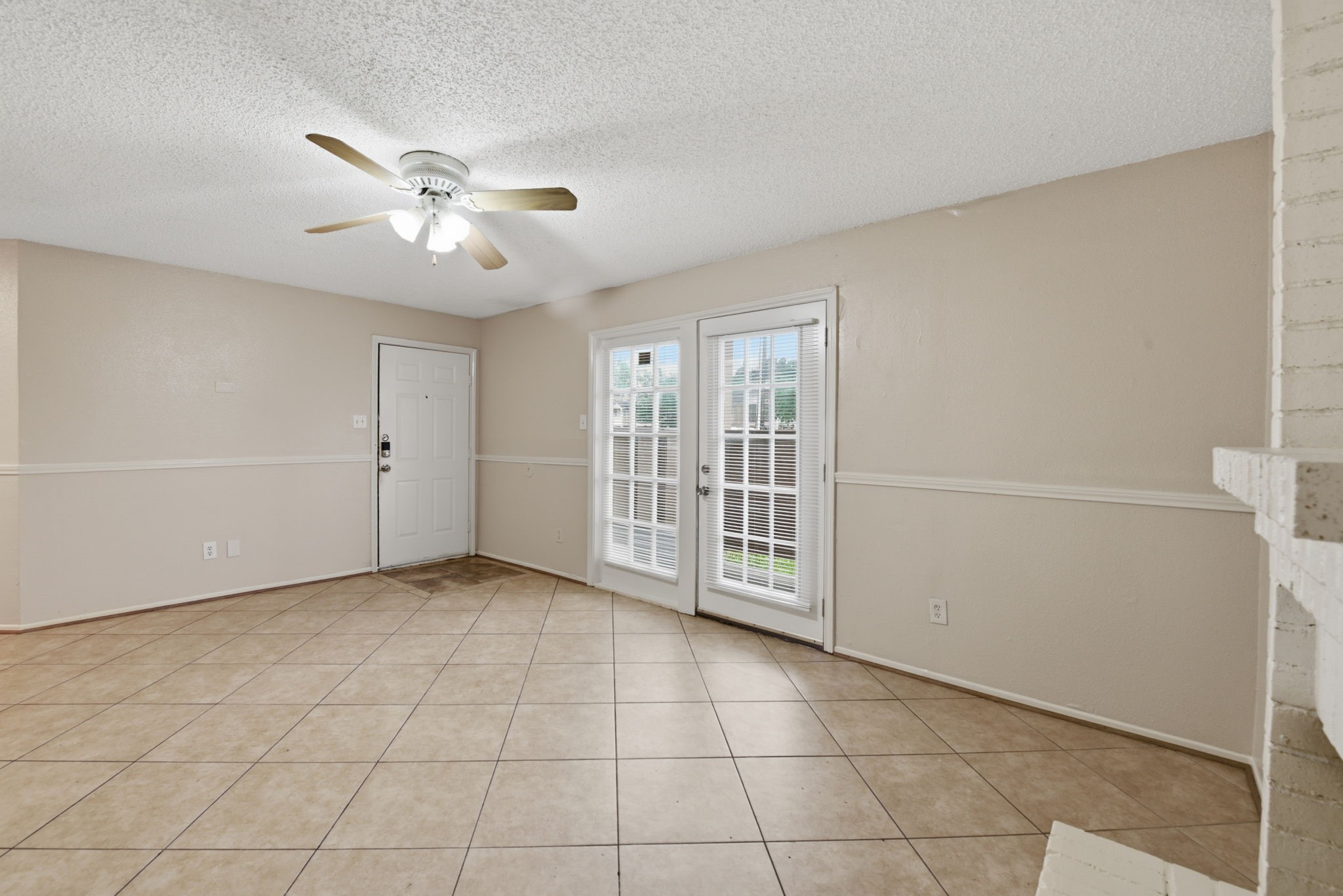 1310 Brenda Lane, Unit A Humble, TX 77338 - Photo 7 of 16 a view of an empty room with a window