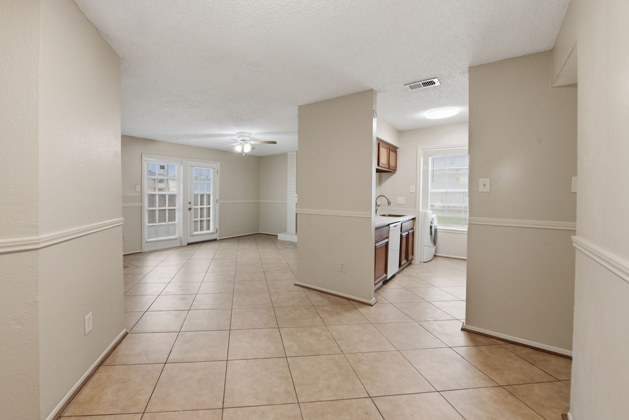 1310 Brenda Lane, Unit A Humble, TX 77338 - Photo 9 of 16 a view of a kitchen with furniture and an empty room