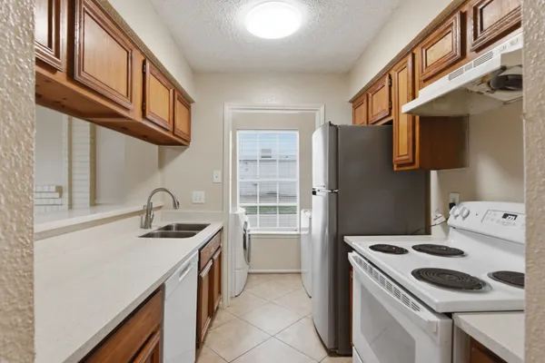 a kitchen that has a stove and a microwave