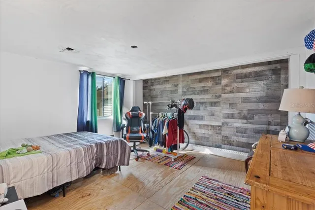 a bed room with a bed and a desk