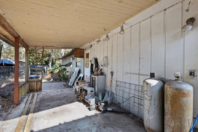 a view of house with backyard space and sitting area