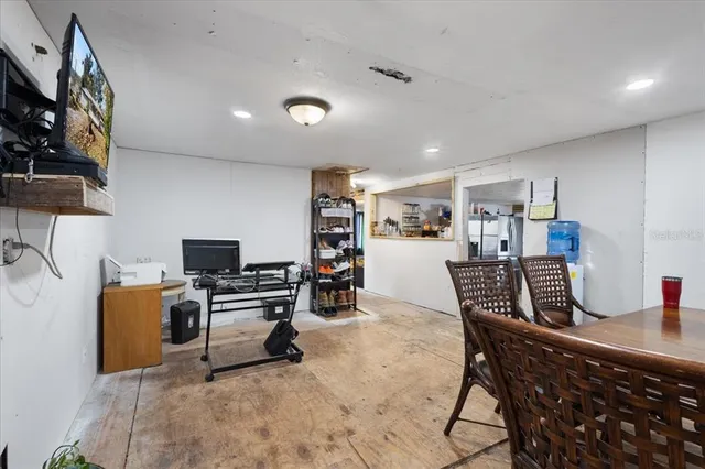 a workspace with furniture and a flat screen tv