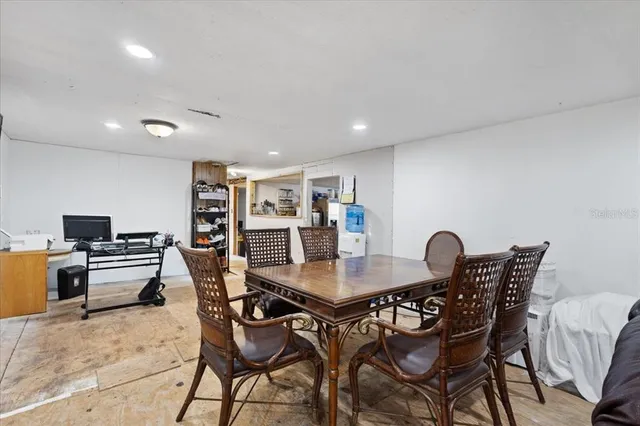 a dining room with furniture and window