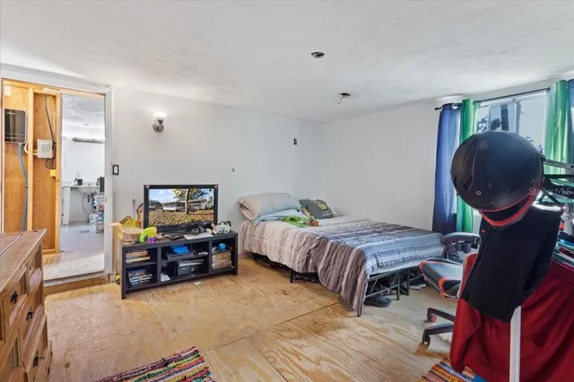 a bedroom with a bed and furniture