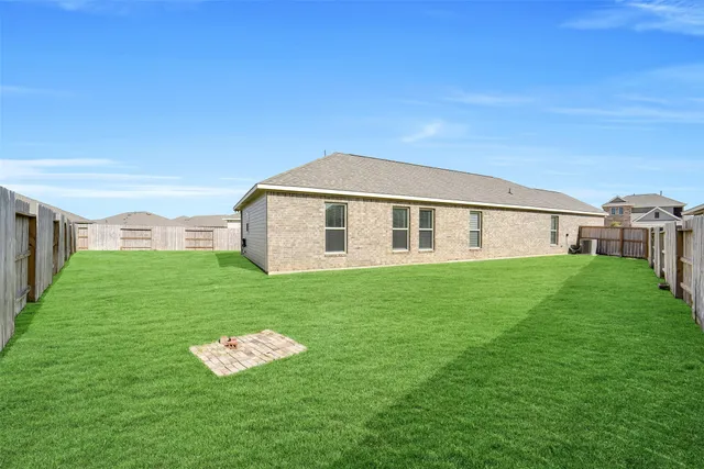 a backyard of a house with lots of green space