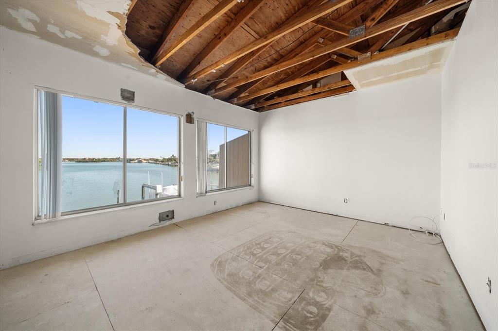 829 East Gulf Boulevard, Unit 107 Indian Rocks Beach, FL 33785 - Photo 14 of 43 a view of an empty room with a sliding door