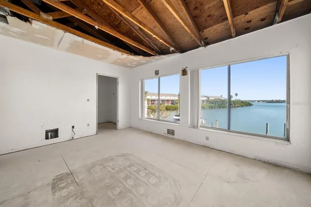 a view of an empty room with windows