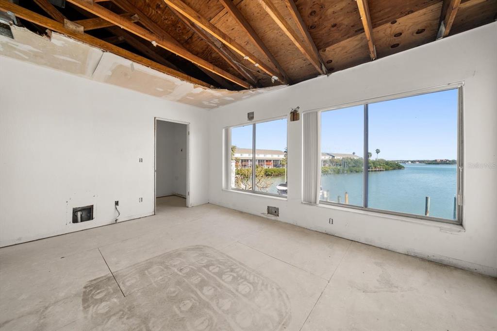 829 East Gulf Boulevard, Unit 107 Indian Rocks Beach, FL 33785 - Photo 15 of 43 a view of an empty room with windows