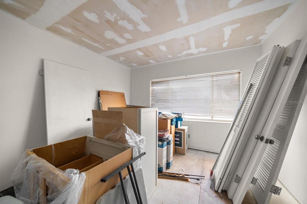 829 East Gulf Boulevard, Unit 107 Indian Rocks Beach, FL 33785 - Photo 18 of 43 a bathroom with a sink and mirror