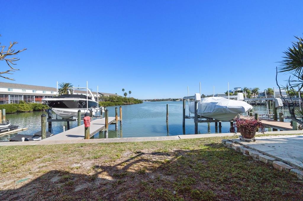 829 East Gulf Boulevard, Unit 107 Indian Rocks Beach, FL 33785 - Photo 27 of 43 a view of a house with a patio